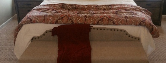 Upholstered bedroom bench and blanket