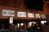 Assorted License Plates Above Bar