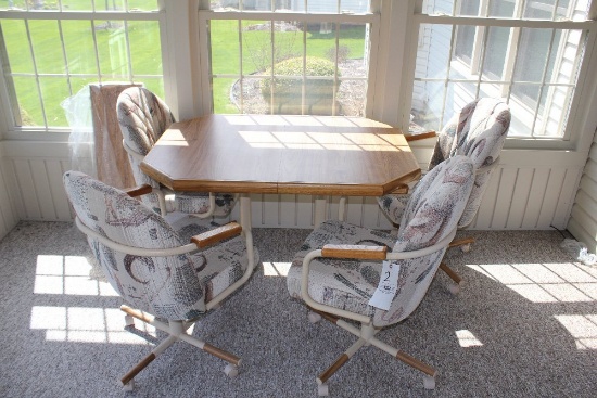 Octagon table w/ 4 upholstered chairs on wheels & extra leaf