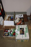 Assorted painting supplies including spray paints