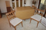 Long drop-leaf table w/ extra leaf, (6) padded chairs & table pads