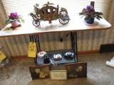 Wrought iron base table - old carved carriage - cameras - pictures