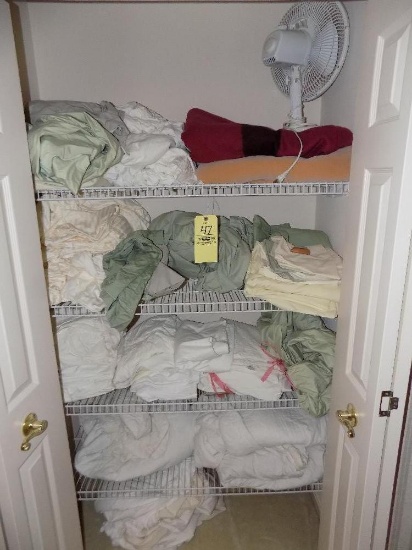 Closet of linens, blankets & sheets, and fan