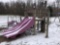 Playground set with sliding board and monkey bars