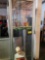 7' Lexan display case on casters with rotating display lighting & contents which are autographed