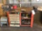 Orange bench, vise, bench grinder, items on peg board