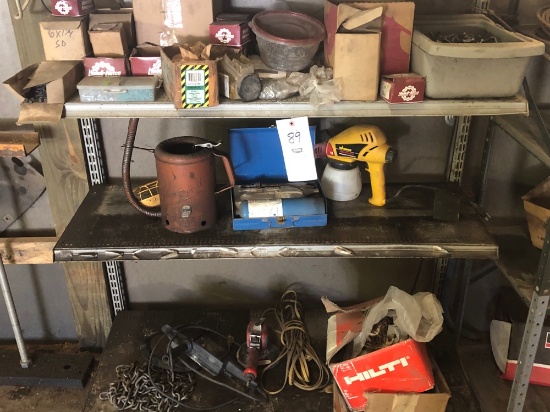 Contents of shelf, stero, screws, oil cans, buffer