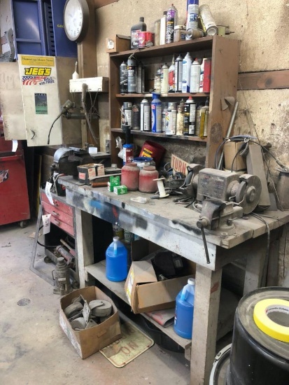 Work bench with vices, grinder and contents.