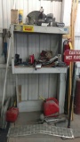 Misc car parts, wet floor sign and gas cans.