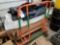 Plywood moving cart with rolls of commercial wrap