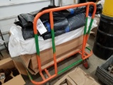 Plywood moving cart with rolls of commercial wrap