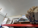 Shelf of shower poles, pic piping, filters, etc