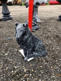 Small concrete dog statue