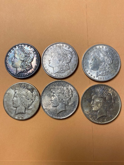 Six silver dollars.