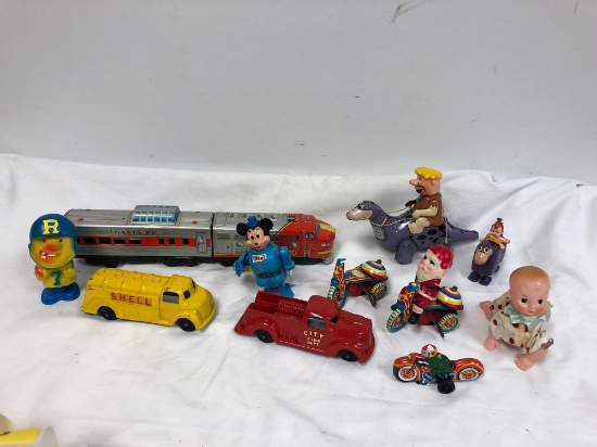 Mickey Mouse toys, vintage Flintstone tin toys, and other miscellaneous toys