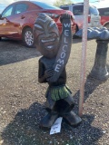 Concrete tiki man welcome statue