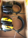 Two radio headsets.