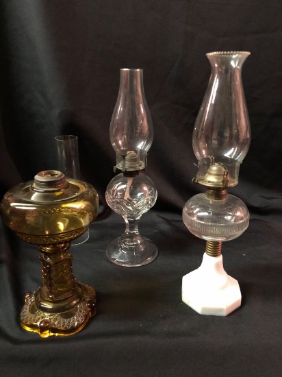 Three early oil lamps