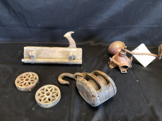 Block plane, wood pulley, early coffee mill, cast trivets