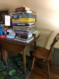 Drop-leaf table, chair, robot and books.