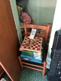 Closet contents. Chair, games, collector plates and bedding