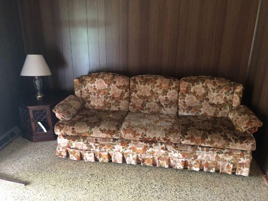 Floral sofa, lamp and end table