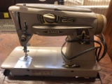 Singer sewing machine and cabinet