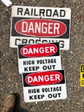Three metal signs.