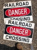 Two metal railroad crossing signs. 24 inches wide.