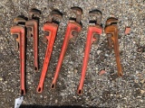 Six rigid pipe wrenches. 12 inch up to 24 inch.