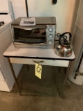 Toaster oven, table, tea pot