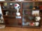 Double glass-front display with helmets, footballs, and figurines