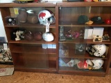 Double glass-front display with helmets, footballs, and figurines