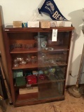 Glass-front shelf with banks, ball cards, pennant