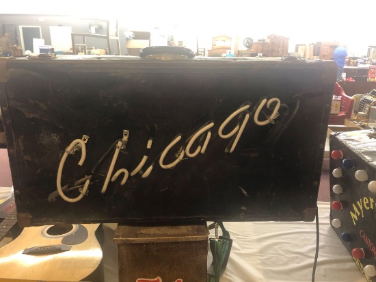 Vintage suitcase with Chicago neon light