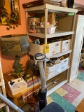 Plastic shelf and plastic cabinet with contents, oak table, lamp