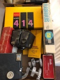 Collection of camera Accessories and flash bulbs, Kodak slide projector slide carrier