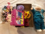 Cabbage Patch doll, Barbie lunchbox, and other miscellaneous toys