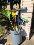 Trash can and yard tools