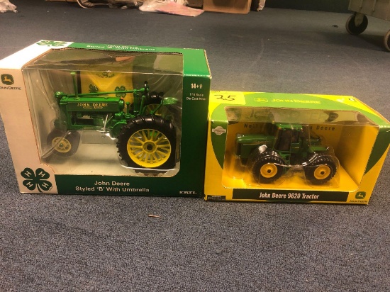 Two John Deere tractors in boxes