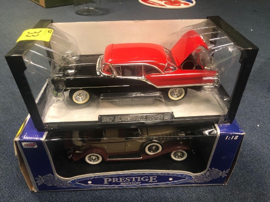 1957 Oldsmobile Super 88 model and 1932 Cadillac Sport Phaeton