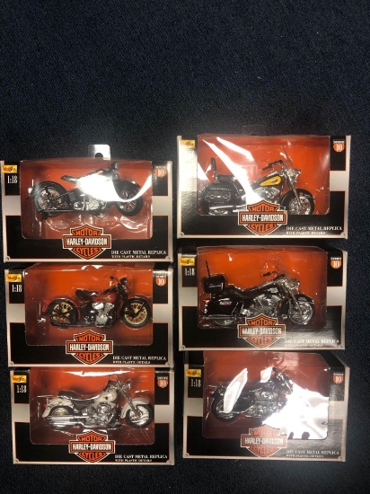 Six Harley Davidson diecast metal replica motorcycle models in boxes