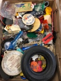 Small tire ashtray, keychains, And tin advertisements