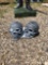 (2) concrete skulls