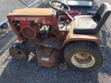 Wheelhorse 12 tractor with deck, spare deck, weights, and tirechains