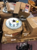 Pallet full of new rotors and calipers
