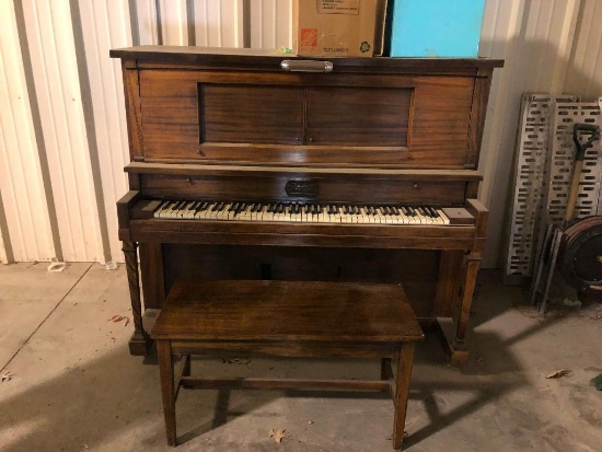 auto player piano with 50 plus rolls and bench