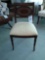 Stenciled and cane-back chair with nail head trim