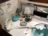 Assorted bathroom decor items.