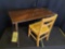 Early oak sewing table with folding legs and wooden chair